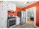 Kitchen with stainless steel appliances, ample storage, and a view of the dining area at 1401 Ash St, Denver, CO 80220