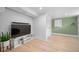 A cozy living room with modern flooring, a TV, and a stylish media console at 1401 Ash St, Denver, CO 80220