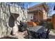 Charming backyard with patio furniture, a grill, and a cozy outdoor dining area at 1265 Saint Paul St, Denver, CO 80206