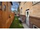 Cozy backyard featuring well-maintained artificial turf and a secure wood fence at 1265 Saint Paul St, Denver, CO 80206
