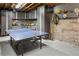 Finished basement with a ping pong table and plenty of storage space at 1265 Saint Paul St, Denver, CO 80206