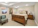 Basement bedroom featuring a queen bed, art and a warm color palette at 1265 Saint Paul St, Denver, CO 80206