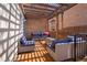 Relaxing outdoor deck space with wicker seating and a pergola at 1265 Saint Paul St, Denver, CO 80206