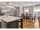 Open-concept kitchen/dining area, with a view of a dining table, chairs, and stylish lighting at 1265 Saint Paul St, Denver, CO 80206