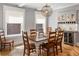 This dining room features hardwood floors, built-in bar with wine cooler, and a modern light fixture at 1265 Saint Paul St, Denver, CO 80206