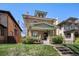 Beautiful two-story home featuring a well-manicured lawn and inviting entrance at 1265 Saint Paul St, Denver, CO 80206