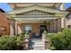 Inviting front porch with seating area perfect for relaxing and enjoying the outdoors at 1265 Saint Paul St, Denver, CO 80206