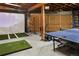 Finished garage with golf simulator, ping pong table and exercise equipment at 1265 Saint Paul St, Denver, CO 80206
