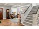 Cozy living room with hardwood floors, comfortable seating, and access to the staircase at 1265 Saint Paul St, Denver, CO 80206
