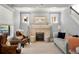 Bright and airy living room featuring a fireplace, neutral tones, and elegant furnishings at 1265 Saint Paul St, Denver, CO 80206