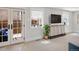 Cozy living room with a view to the deck and a sleek entertainment center at 1265 Saint Paul St, Denver, CO 80206