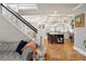 Open-concept living space with staircase and sight lines to the well appointed kitchen at 1265 Saint Paul St, Denver, CO 80206