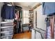 Organized closet with storage shelves, a comfy chair, and clothes at 1265 Saint Paul St, Denver, CO 80206