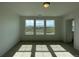Bedroom with large windows providing natural light and scenic views of the landscape at 767 Raindance St, Erie, CO 80516