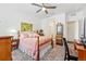 Bright bedroom with a ceiling fan, carpet flooring, and coordinated furnishings at 480 E Fremont Pl # 308, Centennial, CO 80122