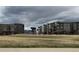 Modern apartment buildings boast mountain views from their location next to open green space at 480 E Fremont Pl # 308, Centennial, CO 80122