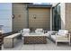 Outdoor lounge area with a fire pit and comfortable seating arrangements at 480 E Fremont Pl # 308, Centennial, CO 80122