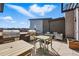 Spacious rooftop patio with grills, seating, and stunning neighborhood views at 480 E Fremont Pl # 308, Centennial, CO 80122