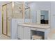 Bathroom featuring a vanity, stall shower with gold-tone hardware, and tile flooring at 329 Bobcat Pt, Lafayette, CO 80026