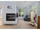 A bedroom sitting area with fireplace and bay window at 329 Bobcat Pt, Lafayette, CO 80026