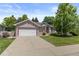 Charming brick home with a well-manicured lawn and an attached two-car garage at 329 Bobcat Pt, Lafayette, CO 80026