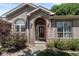 Inviting front entrance with a brick archway and a red front door at 329 Bobcat Pt, Lafayette, CO 80026
