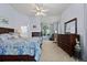 Spacious main bedroom with fireplace, bay window, carpet, and large dresser at 329 Bobcat Pt, Lafayette, CO 80026