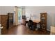 Office with wood floors, large desk, bookcases, and natural light at 329 Bobcat Pt, Lafayette, CO 80026