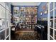 Home office with built-in bookshelves, a piano, and a cozy atmosphere at 329 Bobcat Pt, Lafayette, CO 80026