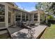 Outdoor patio with a dining set, awning, and well-manicured lawn at 329 Bobcat Pt, Lafayette, CO 80026