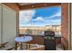 Balcony features a grill, a table and chairs, and a view of the neighborhood at 4100 Albion St # 221, Denver, CO 80216