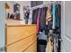 Organized closet with wooden drawers and ample hanging space, designed for efficient storage and easy access at 4100 Albion St # 221, Denver, CO 80216
