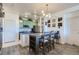 Open dining area with modern light fixture and kitchen access, perfect for entertaining guests at 4100 Albion St # 221, Denver, CO 80216