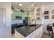 Modern kitchen boasts updated appliances, sleek countertops, and ample cabinet space at 4100 Albion St # 221, Denver, CO 80216
