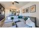 Open concept living room boasts a spacious sectional sofa and decor throughout at 4100 Albion St # 221, Denver, CO 80216