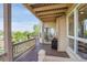Relaxing back deck with a grill, offering views of lush trees and blue skies at 165 Washington St, Golden, CO 80403
