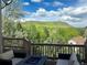 Back deck with scenic view features seating around a fire pit, perfect for enjoying the outdoors at 165 Washington St, Golden, CO 80403