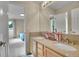 Bright bathroom with double vanity and granite countertops, view to main bedroom at 165 Washington St, Golden, CO 80403
