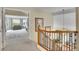 Upstairs hallway featuring carpet and a glimpse into an open bedroom space at 165 Washington St, Golden, CO 80403