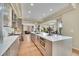 The kitchen features stainless steel appliances, an island, and is open to the living and dining spaces at 165 Washington St, Golden, CO 80403