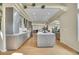Modern, open kitchen with stainless steel appliances, a large island, and hardwood flooring at 165 Washington St, Golden, CO 80403