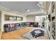 Spacious living room with a large black couch, a modern glass table, and hardwood floors at 165 Washington St, Golden, CO 80403