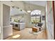 The living room opens to a kitchen and features beautiful hardwood floors and an open window at 165 Washington St, Golden, CO 80403
