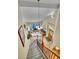 Bright living room with hardwood floors, large windows, and staircase overlooking the entry at 165 Washington St, Golden, CO 80403