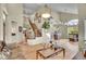 Open-concept living room with wood floors, staircase, and an open floorplan at 165 Washington St, Golden, CO 80403