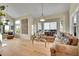 Bright, open living room with hardwood floors and large windows offers ample natural light at 165 Washington St, Golden, CO 80403