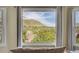 Close up of exterior view of a mountain from inside of the home, framed by the window at 165 Washington St, Golden, CO 80403