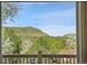 Scenic vista from the house's window showcases green trees and mountain views at 165 Washington St, Golden, CO 80403