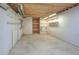 Unfinished basement with pegboard walls and shelving provides ample storage and organization potential at 11884 Elk Head Range Rd, Littleton, CO 80127