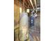 Utility space with a water heater and furnace, ensuring home comfort and efficiency at 11884 Elk Head Range Rd, Littleton, CO 80127